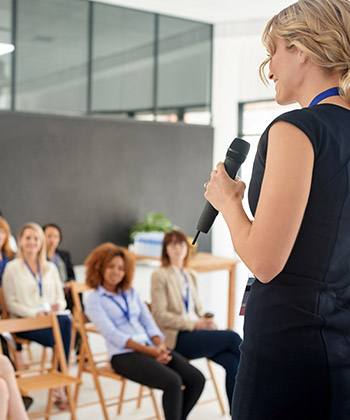 Learning and development woman presenting in front of a group