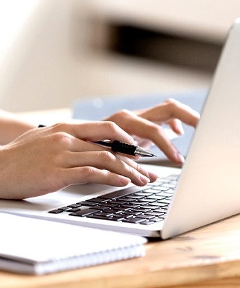 hands with a laptop