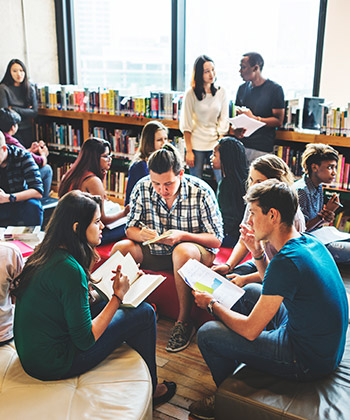 group of adult students in a library