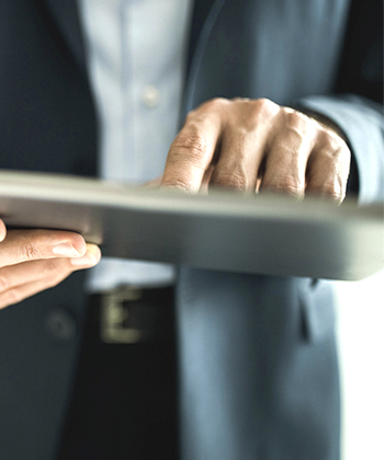 man holding his tablet