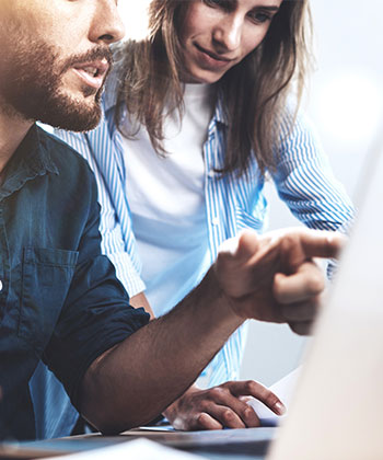 man pointing at computer screen