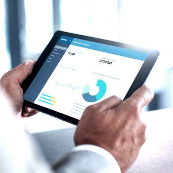 The future of Europe's Fintech revolution working on graphs from a tablet