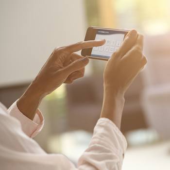 Going beyond the Internet of Things hands holding a smartphone