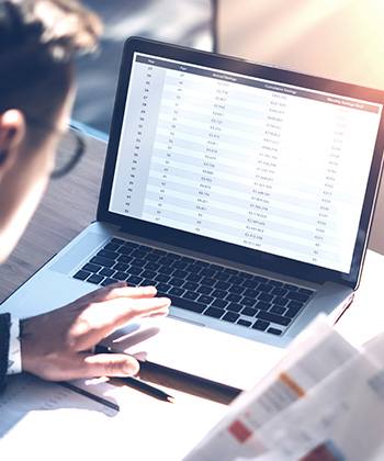 How does optimisation fuel growth? man typing on a laptop