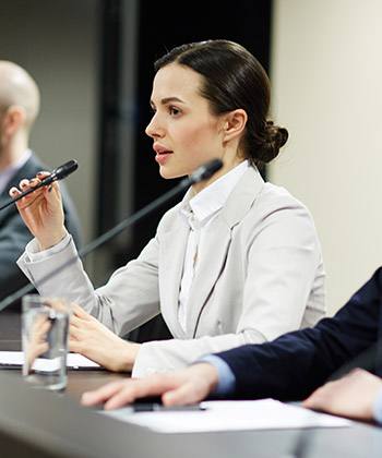 businesswoman at a press conference