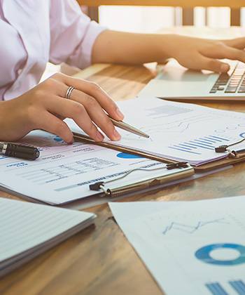 How does digital transformation drive efficiency? writing in a notebook