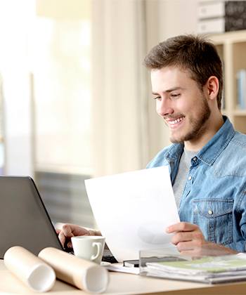man looking into a screen 
