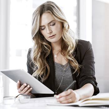 What a home working policy looks like woman working with her tablet