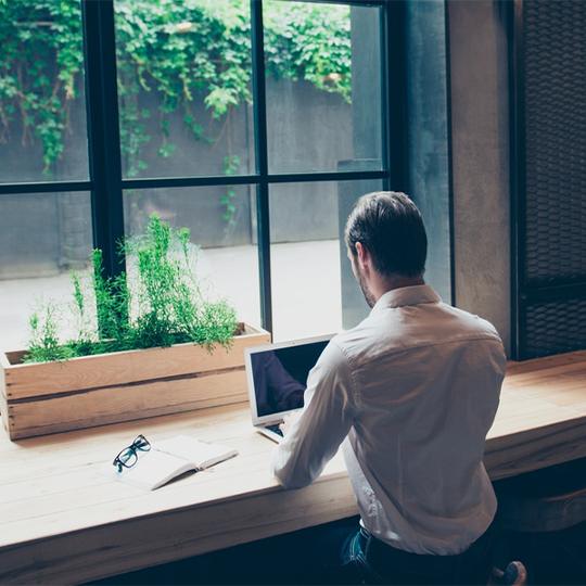 Kyocera recognised in Gartner Magic Quadrant man working with a laptop